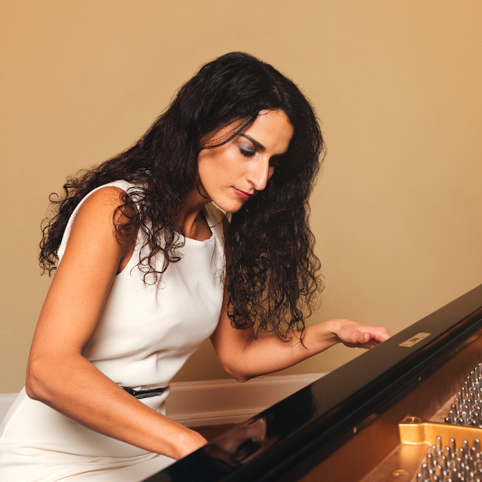 Sepideh Baradaran playing the piano side perspective