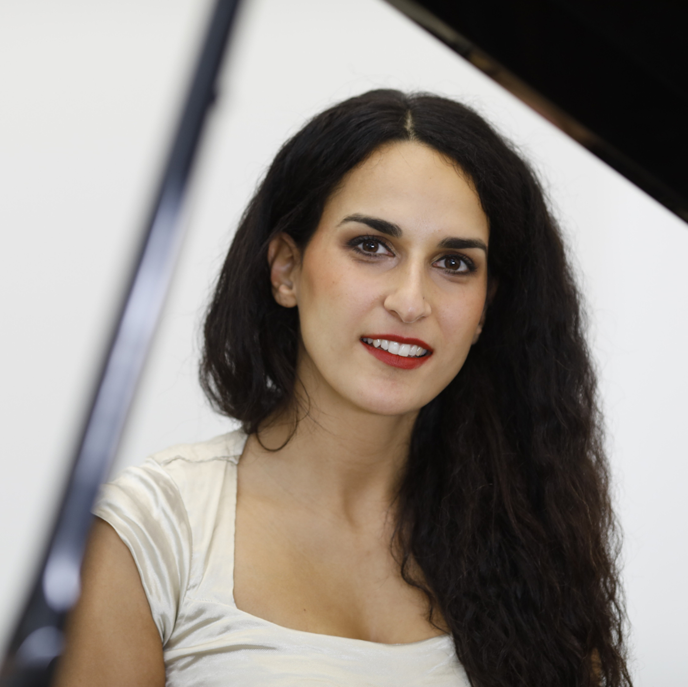 Sepideh Baradaran Portrait sitting at piano